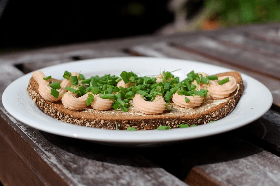 Oslo trip: Scandinavian feast with Kalix Löjrom on toast melba, sour cream, and chives.